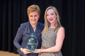Iona Fyfe being presented the STUC Equality Award 2022 by the First Minister at STUC Congress